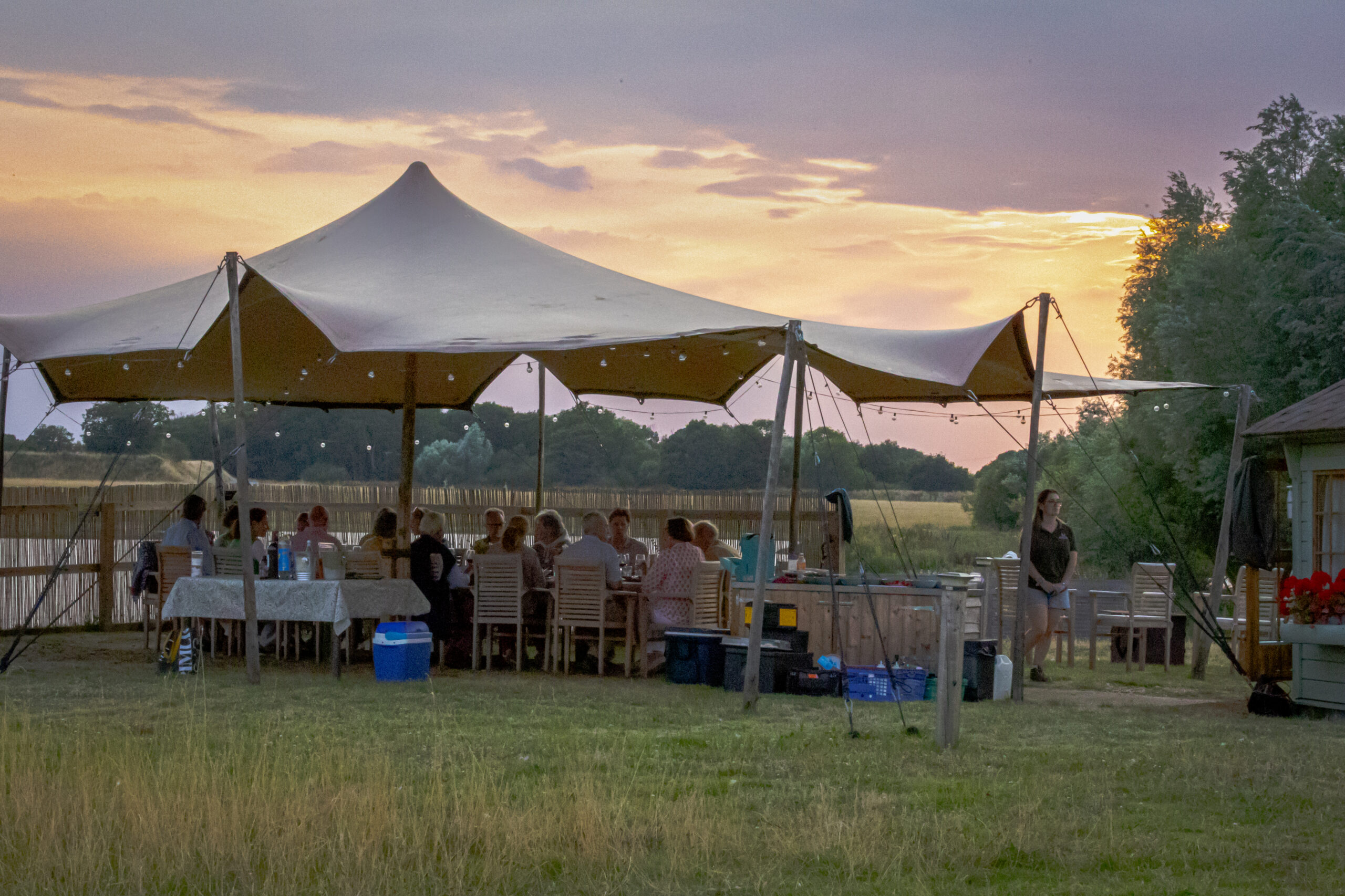 Lakeside BBQ hut in the sunset